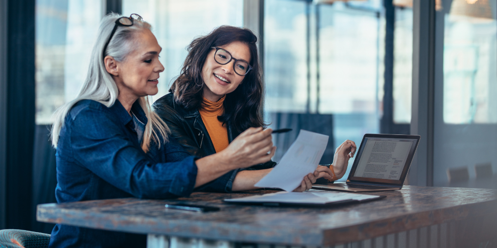 2 women discussing private equity and talent research 