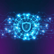 Glowing blue shield with a keyhole at the centre of a digital network pattern, surrounded by interconnected lines and nodes, symbolising the implementation of cyber essentials to maintain a secure digital environment.