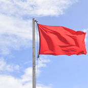 A red flag representing what investors should watch for