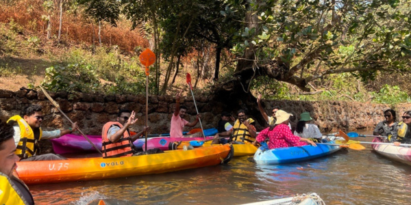 People Kyaking In bright coloured kyaks