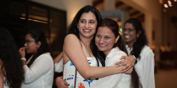 Two women hugging