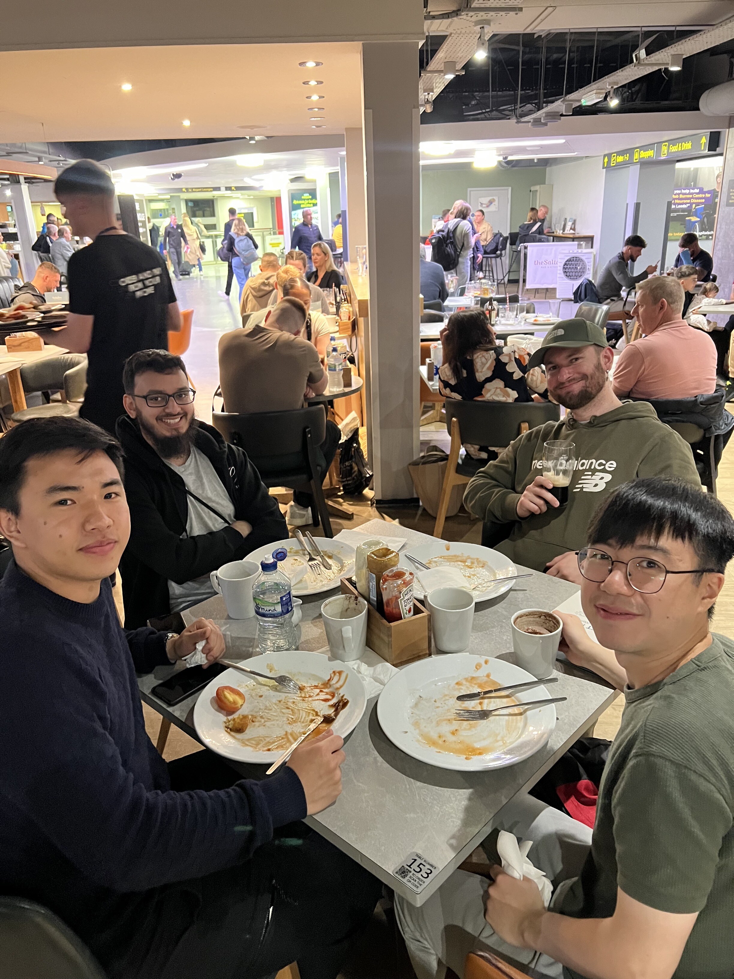 Abstract Group enjoying breakfast at the airport 