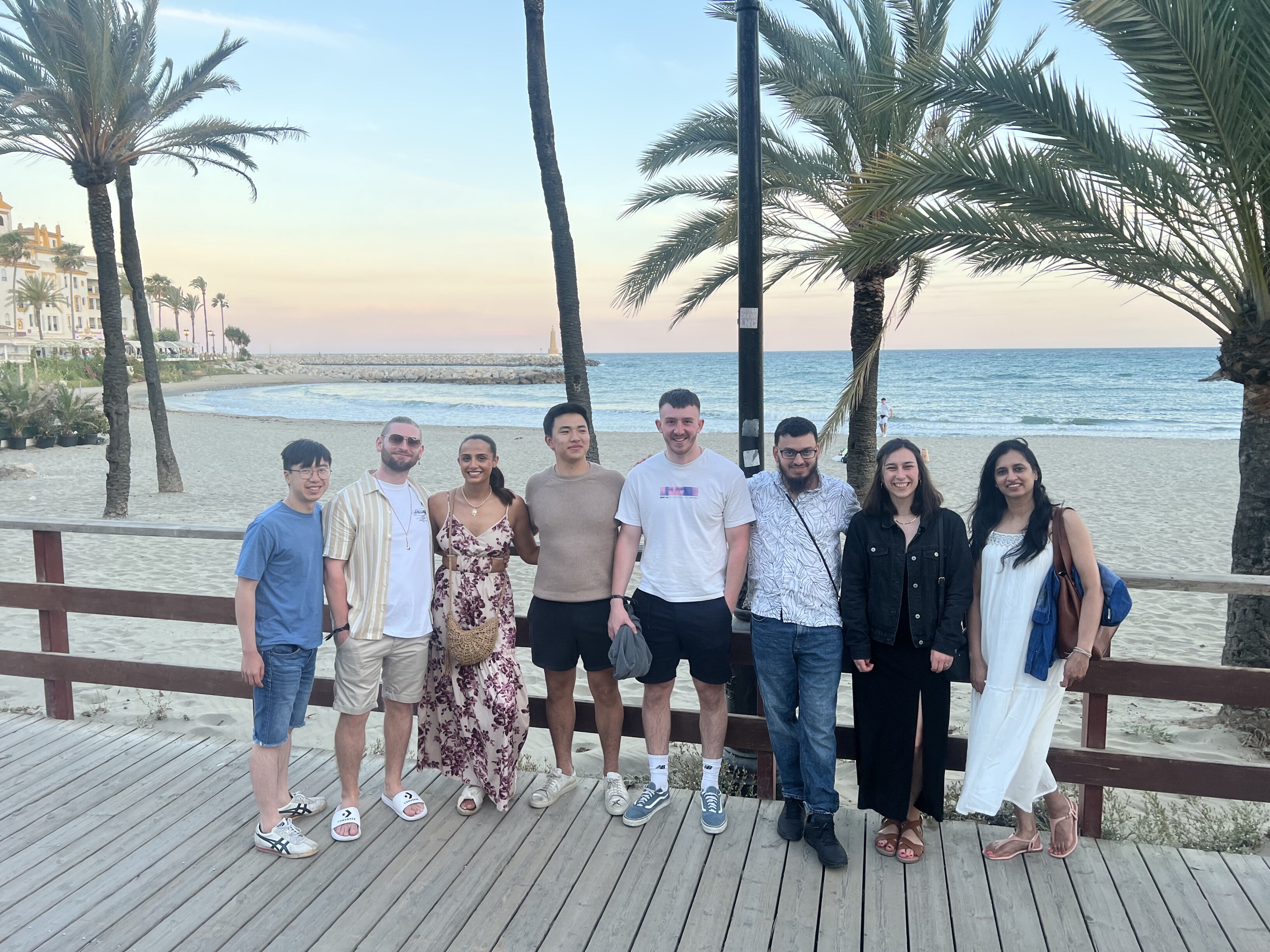 Abstract Group staff in front of the sea