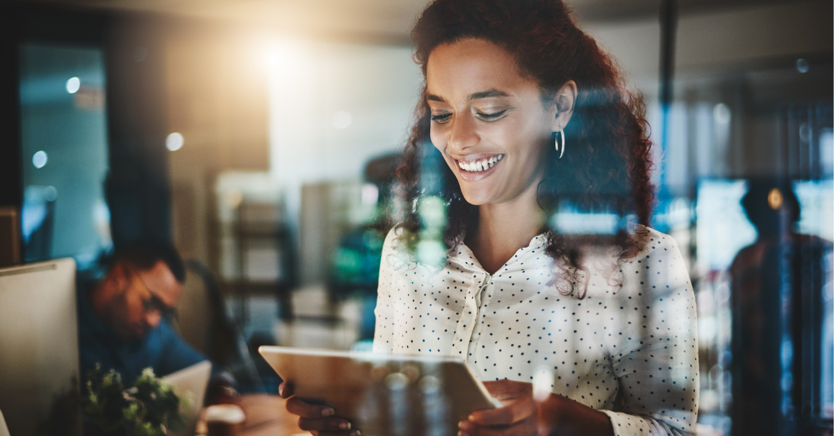 woman smiling at device 